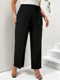 Pantaloni conici casual e versatili di taglia grande con cinghie legate lateralmente e un design alla moda