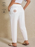 Pantaloni harem casual da vacanza taglie forti con ricamo a occhio