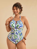 Costume da bagno intero con stampa tropicale blu e bianca a motivi floreali e vegetali, taglio sul retro e vita stretta, casual da spiaggia per vacanze
