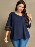 Blusa con dettagli di maniche in rete e collo asimmetrico