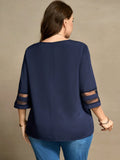 Blusa con dettagli di maniche in rete e collo asimmetrico