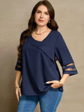 Blusa con dettagli di maniche in rete e collo asimmetrico