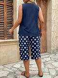 Set da 2 pezzi, con top a canotta scollo a V e orlo asimmetrico e pantaloni stampati a pois 3/4, casual e confortevole