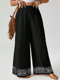Pantaloni casual a gamba larga con stampa posizionata, in cotone