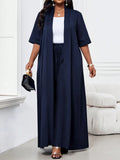 Set elegante in due pezzi composto da blusa con maniche lunghe e corte e gonna lunga, in tessuto intrecciato