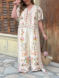 Set donna Completo  casual con top a maniche corte e pantaloni zampa d'elefante floreali
