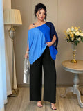 Set in 2 pezzi di taglia comoda: blusa con maniche a pipistrello con taglio asimmetrico e decoro blu degradato a oro, e pantaloni a zampa neri con chiusura lampo e bottoni