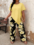 Set da donna Taglie Forti: Top a maniche corte con scollo tondo e orlo asimmetrico in colore unito e Pantaloni con stampa floreale