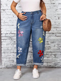 Jeans di taglia comoda in denim lavato, ricamati con motivi floreali e strappati