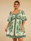 Abito casual corto con stampa floreale gialla e maniche a palloncino per donne taglia curvy