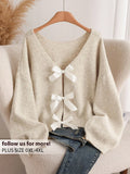 Maglione lavorato a maglia comodo e versatile con abbellimento a fiocco, adatto per donne di taglia grande, adatto per l'autunno/inverno