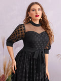 Abito a pois in maglia con cintura