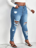 Jeans skinny lavaggio con candeggina con strappati
