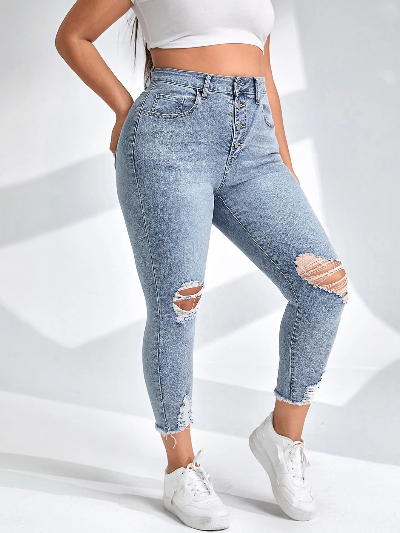 taglie forti Jeans skinny con bottone con strappati con taglio grezzo