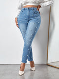 taglie forti Jeans skinny vita alta con perline con taglio grezzo