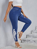 Taglie Forti Jeans skinny applicazioni floreali